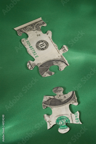 2 pieces of a currency puzzle