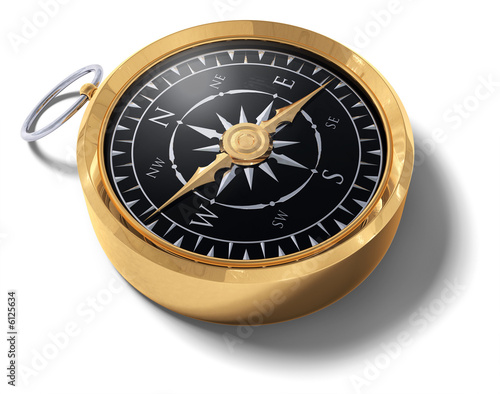 An old fashoned brass compass on a white background photo