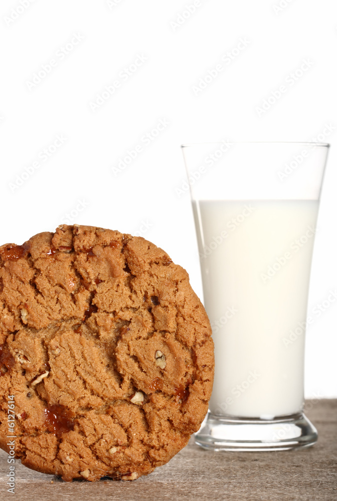 milk glass with toffee pecan cookie on burlap canvas milk glass with toffee pecan cookie on burlap canvas