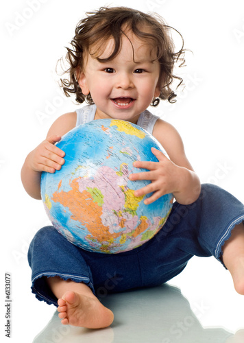 Baby with puzzle globe.