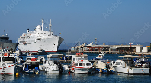 Shipyard with small yachts and a big white cruise ship © Fyle