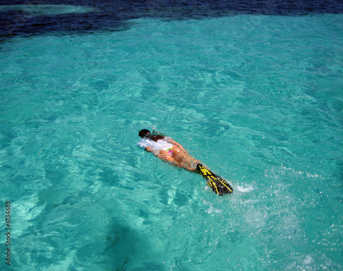 Female Snorkeler Swimming to Reefs in the Caribbean
