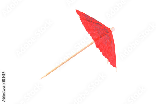 Red cocktail umbrella on white
