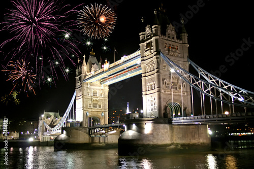 fireworks celebration over tower bridge at night