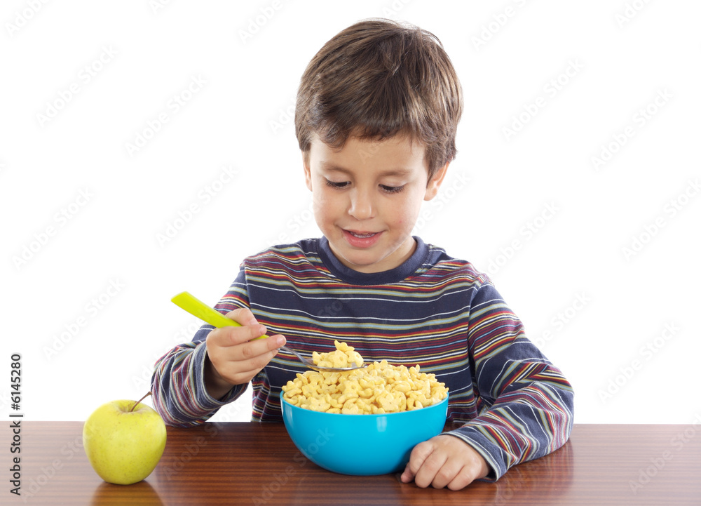 Adorable child breakfasting a over white background Adorable child breakfasting a over white background