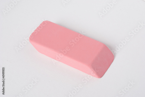 a pink rubber pencil eraser on a white seamless background photo