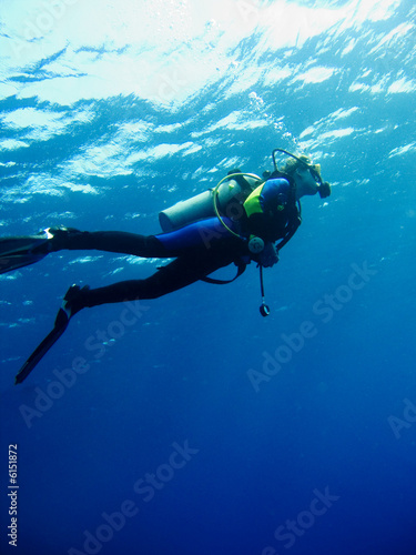 Scuba diver in clear blue water
