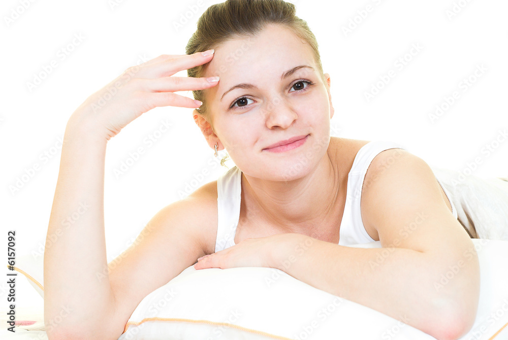 Pretty girl is lying in her bed. Isolated. Pretty girl is lying in her bed. Isolated.