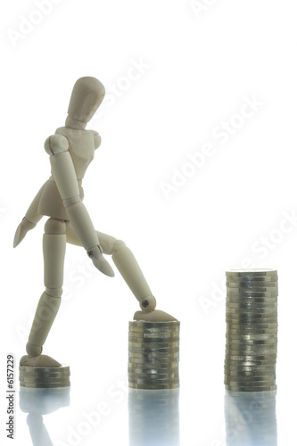 Manikin going up three coin piles