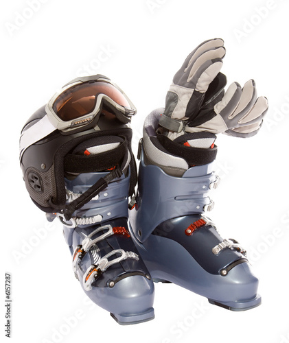 Ski boot's helmet glove and goggles. Isolate on white