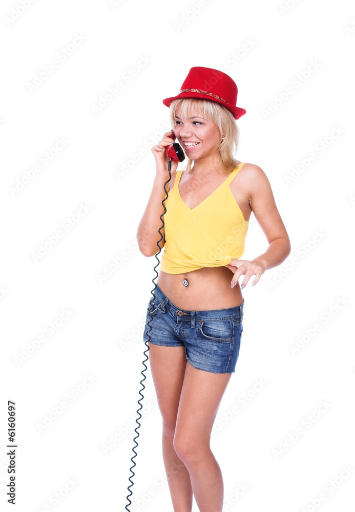 The girl and the red phone on a white background The girl and the red phone on a white background