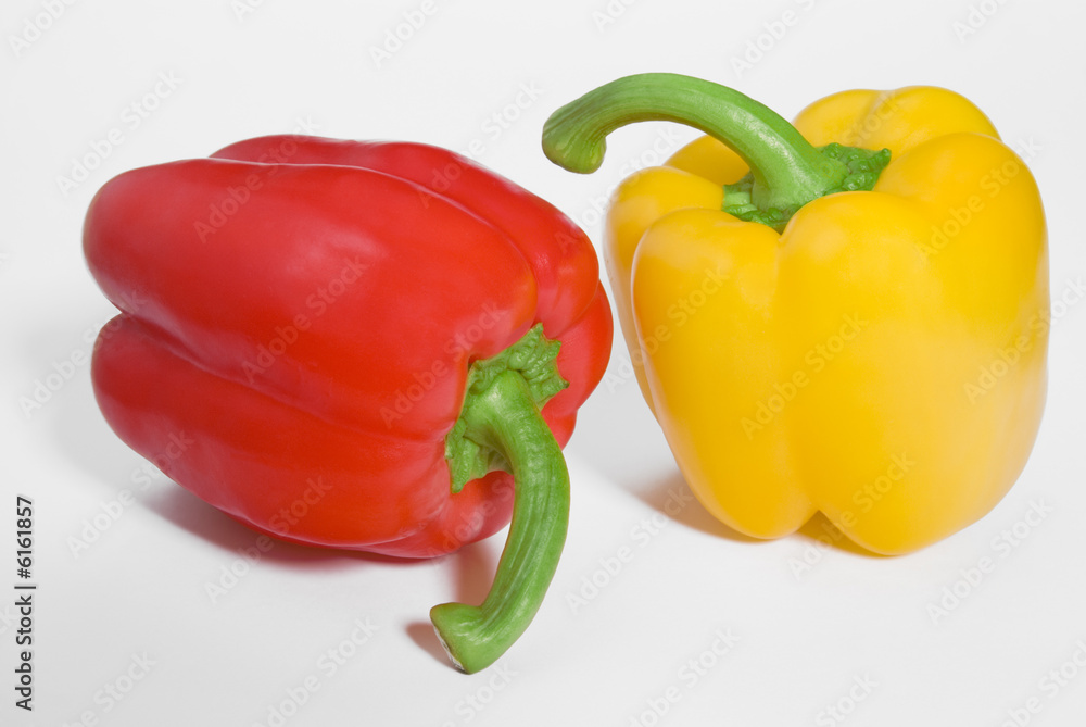 Two ripe peppers on white background with shadows Two ripe peppers on white background with shadows