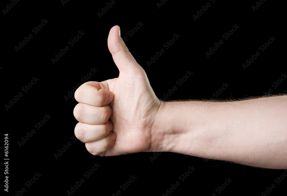 Thumb up. Isolated on a black background. Thumb up. Isolated on a black background.