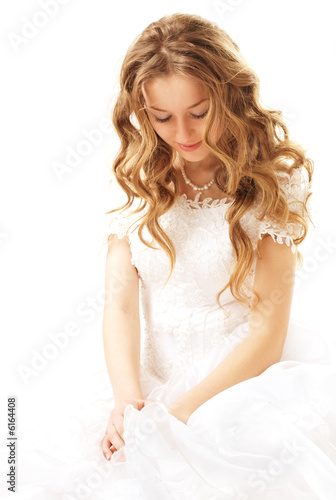 sitting beauty bride in white dress isolated