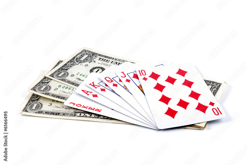 Three denominations one dollar laid by fan and playing cards