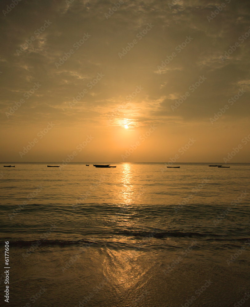 Golden mombasa beach sunrise Kenya Africa.