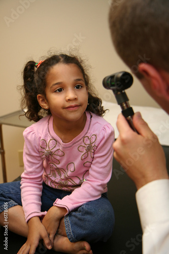 Doctor checks young child i...