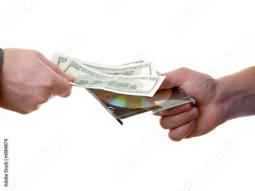 Man's hand with dollars and CD isolated at the white background