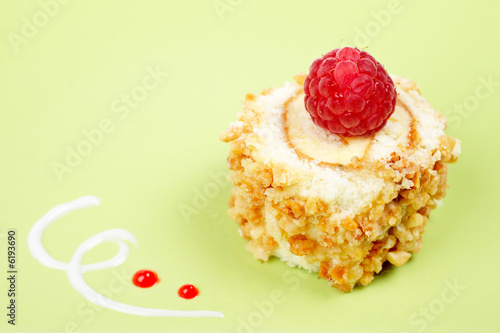 Delicious cake with soft shadow on green dish. Shallow DOF photo