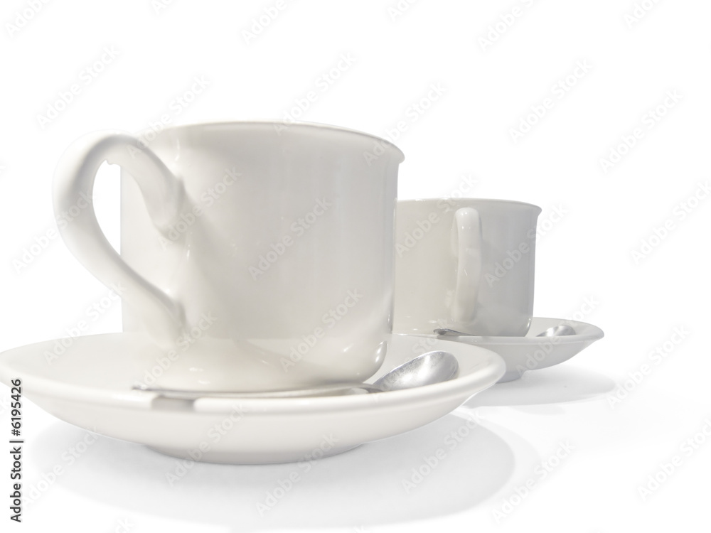 Two white coffee cups isolated on a white background Two white coffee cups isolated on a white background