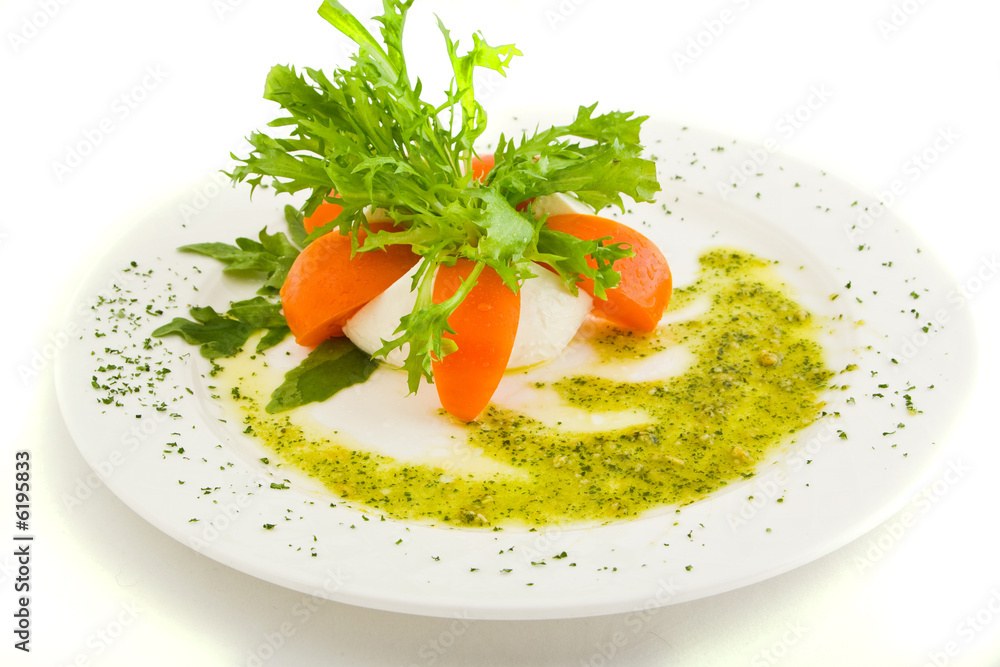 Plate with cheese, tomatoes, greens and sauce Plate with cheese, tomatoes, greens and sauce