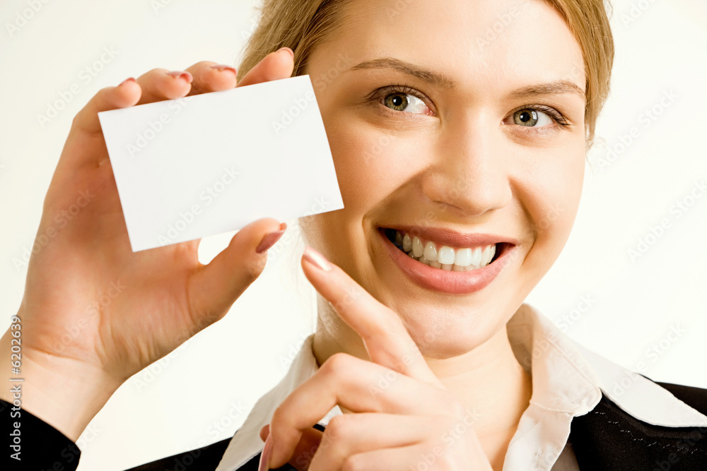 Image of pretty business woman holding a business card 
