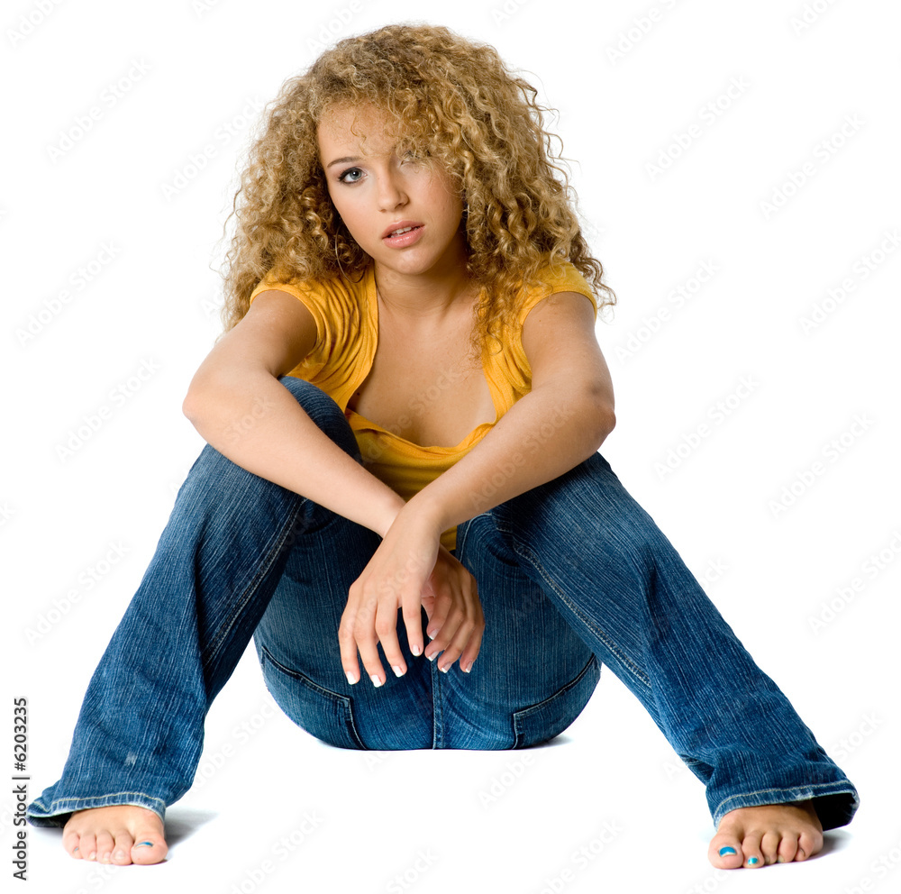 A pretty teenage girl in yellow top and jeans Stock Photo | Adobe Stock