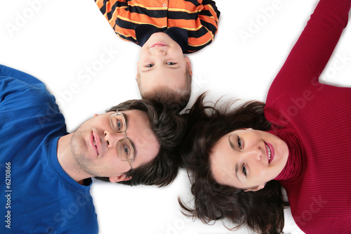 Parents with son lying top view