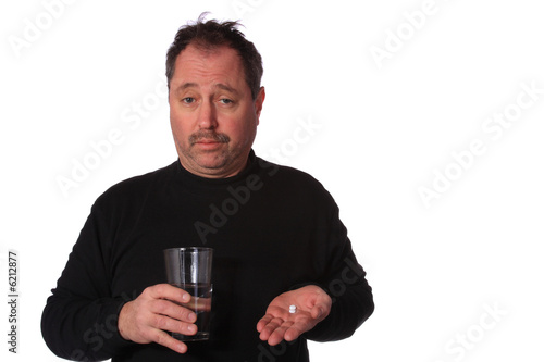 Man taking two pills on a White Background. 