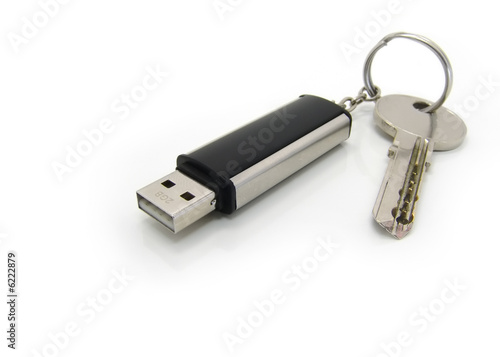 USB drive on keyring with a key. Close up. photo