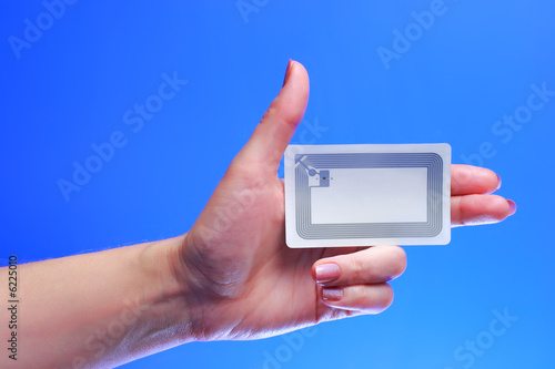 woman holding Radio-frequency identification (RFID) tag card