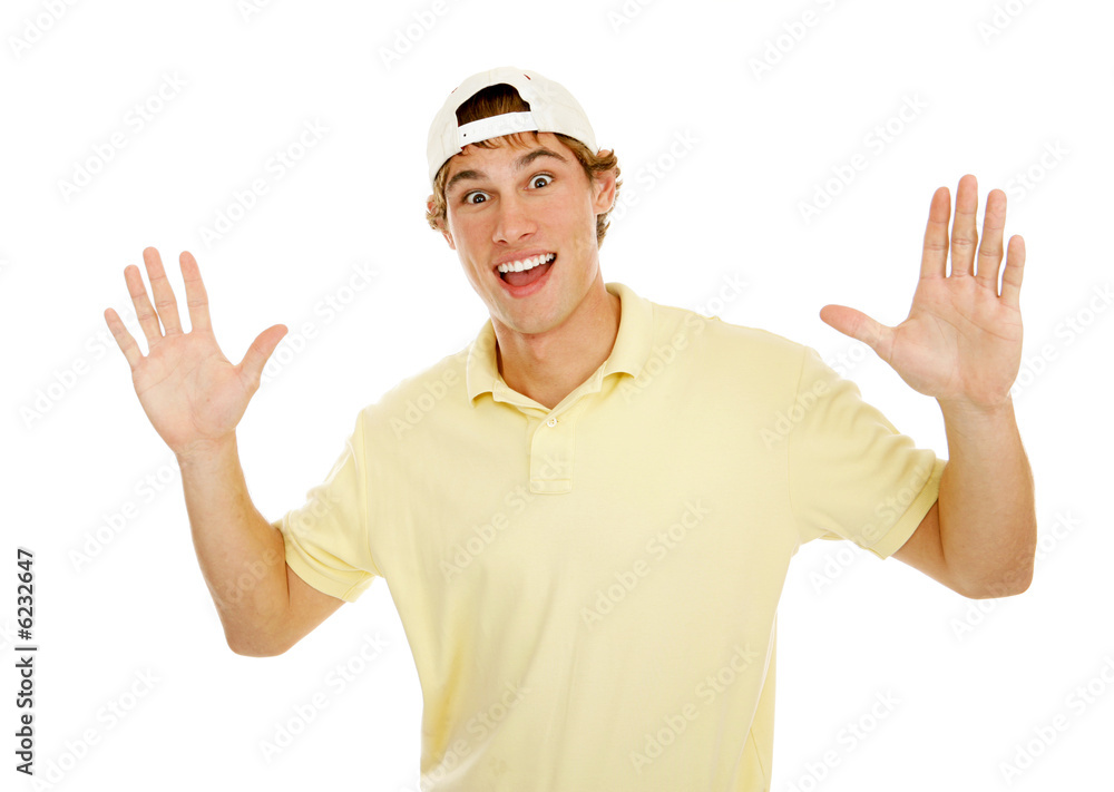 Young college age man throws up his hands in surprise. Young college age man throws up his hands in surprise.