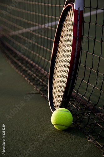 A shot of a tennis racquet and a tennis ball  © arekmalang