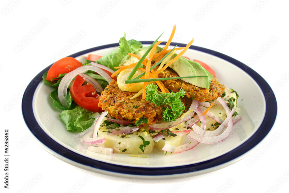 Carrot And tuna patties on a herbed potato stack with salad.