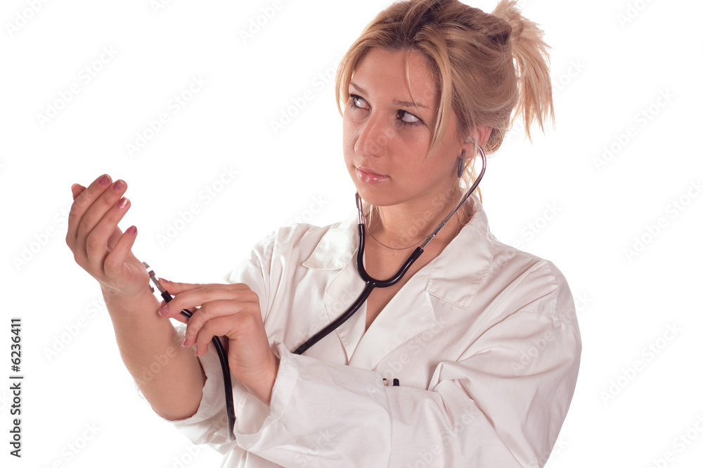 Female doctor taking pulse with stethoscope herself Female doctor taking pulse with stethoscope herself