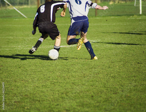 Fototapeta Naklejka Na Ścianę i Meble -  soccer players in action. in duel for the bal.