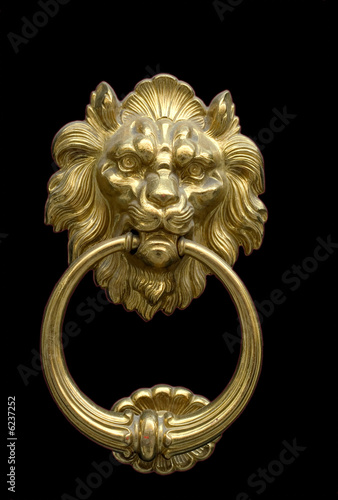 Impressive bronze doorknocker with Lion on a black background