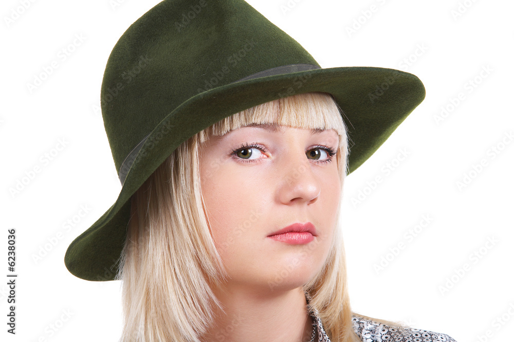 Portrait of blonde girl in black hat on the white background Portrait of blonde girl in black hat on the white background