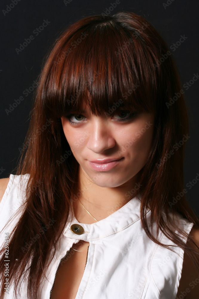 Portrait of a nice beauty of the girl on a black background