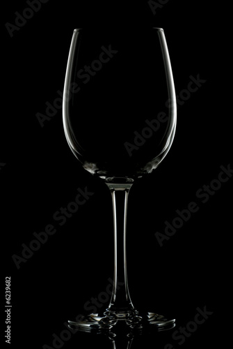 Silhouette of red wine glass  - isolated on black.