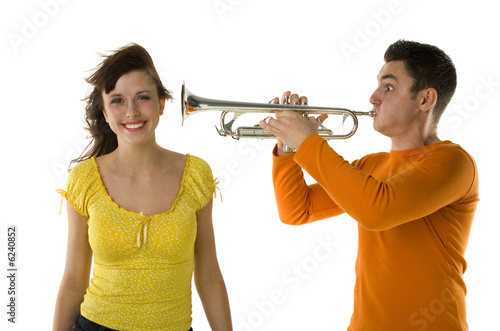 The man trumpet straight to the woman ear.  photo