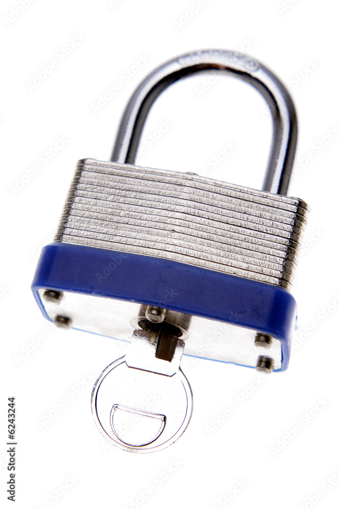 Padlock and key isolated over white Padlock and key isolated over white