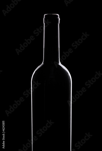 Wine bottle against black background