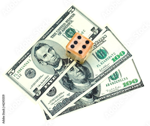 Close up of dice on dollars