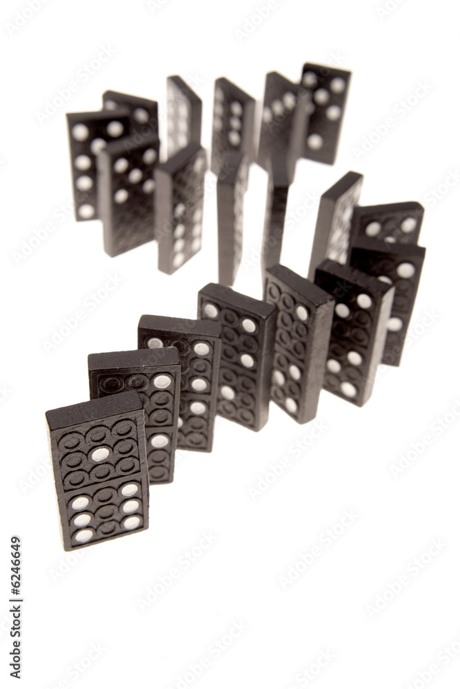 Dominoes standing in a row over white background Dominoes standing in a row over white background