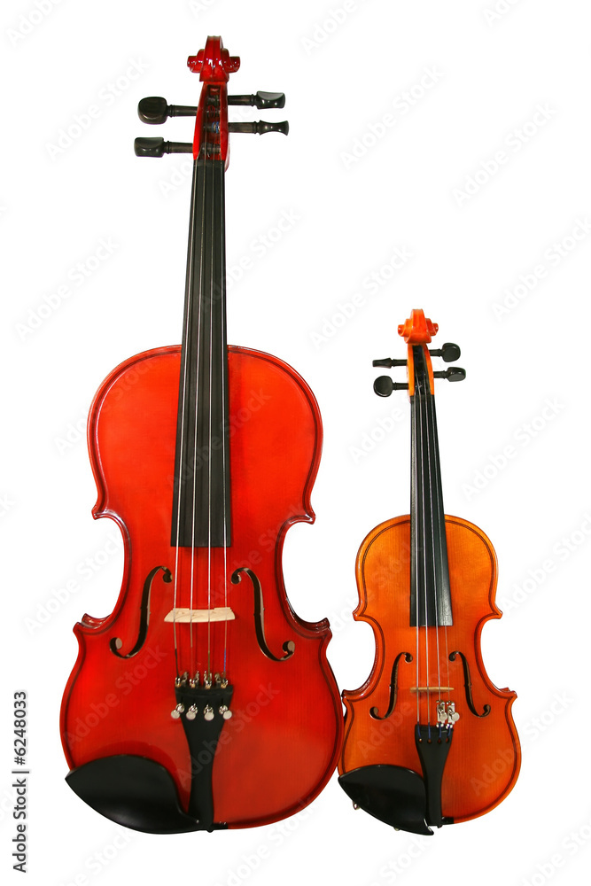 Naklejka premium Two violins isolated on a white background.