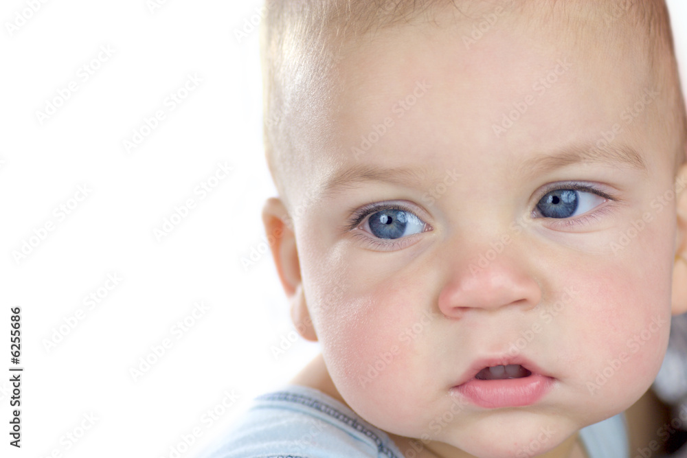 Close-up portrait of sad baby isolated on white
