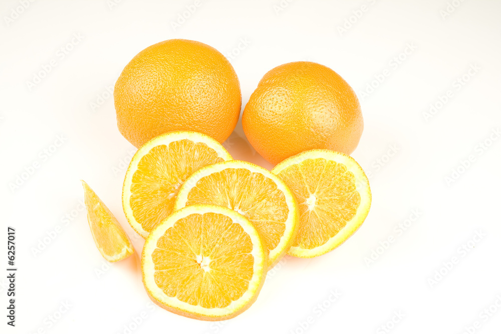 Oranges and slices isolated on white background