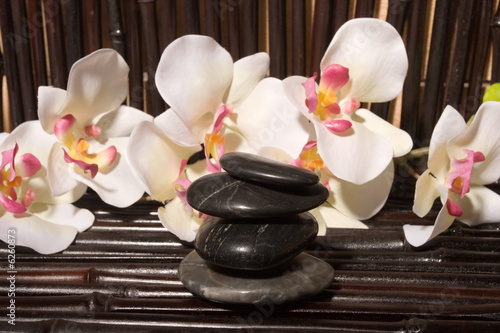 Sticker Massage stones and orchid flowers on bamboo