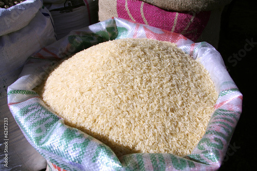 white rice in sack at market photo
